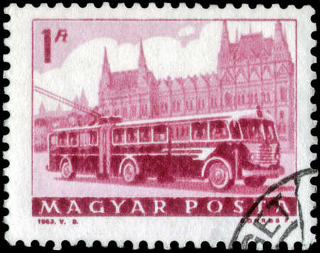 Saint Petersburg, Russia - April 30, 2020: Stamp issued in the Hungary with the image of the trolleybus and Parliament. From the series on Transport and Telecommunication, circa 1963のeditorial素材