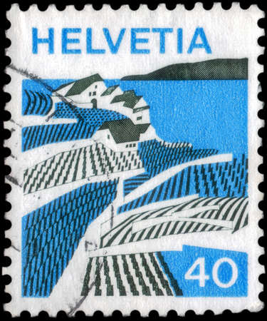 Saint Petersburg, Russia - May 05, 2020: Stamp printed in the Switzerland with the image of the Riex, Waadt, circa 1973のeditorial素材