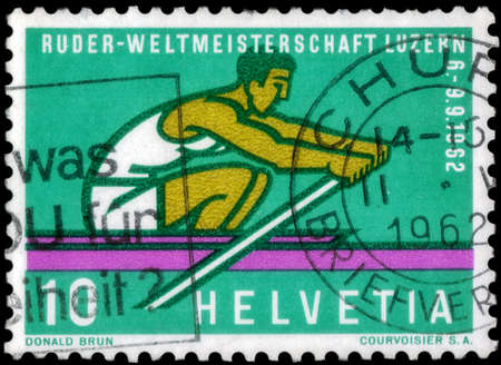 Saint Petersburg, Russia - May 05, 2020: Stamp printed in the Switzerland with the image of the Rower, circa 1962のeditorial素材