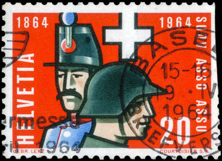 Saint Petersburg, Russia - May 05, 2020: Stamp printed in the Switzerland dedicated to the Centenary of the Swiss Noncommissioned Officers Association, circa 1964のeditorial素材