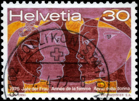 Saint Petersburg, Russia - May 05, 2020: Stamp printed in the Switzerland dedicated to the International Year of Women, circa 1981のeditorial素材