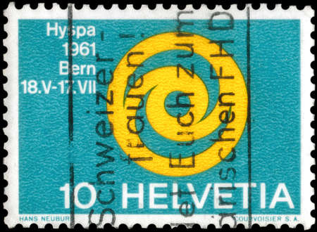 Saint Petersburg, Russia - May 05, 2020: Stamp printed in the Switzerland with the image of the Emblem of Exhibition HYSPA, Symbolic sun, circa 1961のeditorial素材