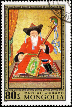Saint Petersburg, Russia - May 17, 2020: Stamp printed in the Mongolia with the image of The Wise Musician, by Sarav, circa 1972のeditorial素材