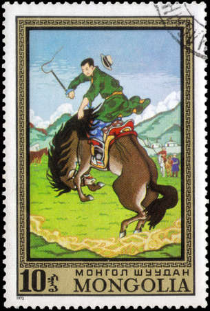 Saint Petersburg, Russia - May 17, 2020: Stamp printed in the Mongolia with the image of the Taming Wild Horse, circa 1972のeditorial素材
