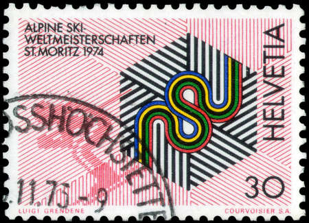 Saint Petersburg, Russia - May 17, 2020: Postage stamp issued in the Switzerland dedicated to the Intl. Alpine Skiing Championships, St. Moritz, circa 1973のeditorial素材