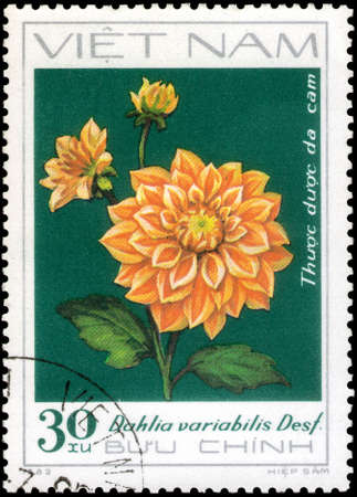 Saint Petersburg, Russia - May 31, 2020: Stamp printed in the Vietnam with the image of the Orange Dahlia, circa 1982のeditorial素材