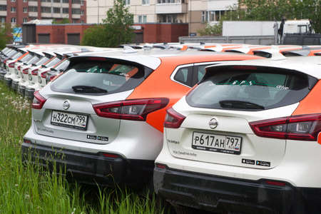 Saint Petersburg, Russia - June 06, 2020: Nissan Qashqai carsharing company YouDrive cars parked in a vacant lot during restrictions due to the epidemic.のeditorial素材