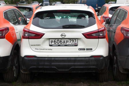 Saint Petersburg, Russia - June 06, 2020: Nissan Qashqai carsharing company YouDrive cars parked in a vacant lot during restrictions due to the epidemic.のeditorial素材
