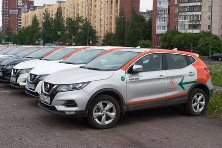 Saint Petersburg, Russia - June 06, 2020: Nissan Qashqai carsharing company YouDrive cars parked in a vacant lot during restrictions due to the epidemic.のeditorial素材