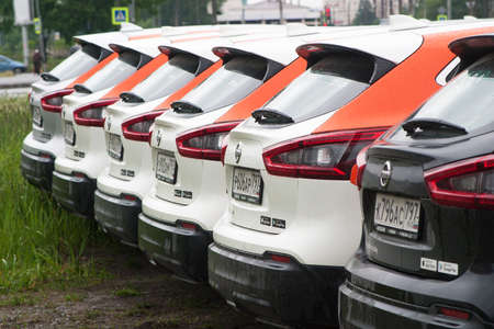 Saint Petersburg, Russia - June 06, 2020: Nissan Qashqai carsharing company YouDrive cars parked in a vacant lot during restrictions due to the epidemic.のeditorial素材