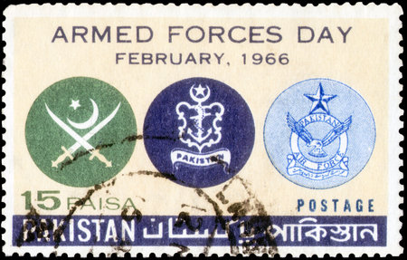 Saint Petersburg, Russia - November 12, 2020: Postage stamp issued in the Pakistan with the image of the Army, Navy and Air Force Crests. From the series on Armed Forces Day, circa 1966のeditorial素材