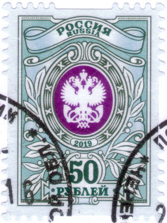 Saint Petersburg, Russia - December 05, 2020: Postage stamp issued in Russia with the image of the State Postal Administration Emblem. From the series on 7th Definitive Issue, circa 2019のeditorial素材