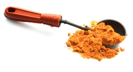 turmeric powder with wood spoonの写真素材