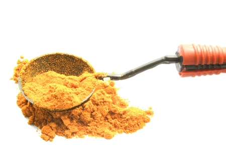 turmeric powder with wood spoonの写真素材