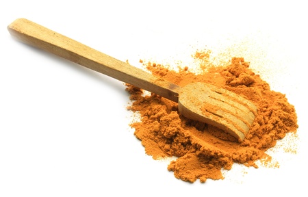 turmeric powder with wood spponの写真素材