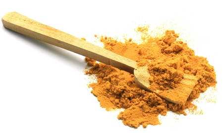 turmeric powder with wood spponの写真素材