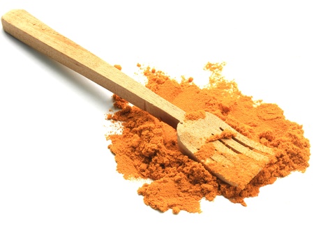 turmeric powder with wood spponの写真素材
