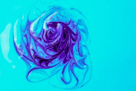 purple streaks on a blue soft yogurt backgroundの写真素材