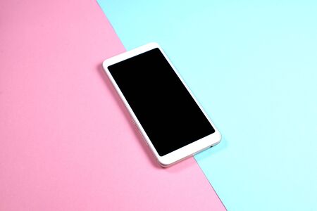 white phone with black screen for your lettering on blue and pink background