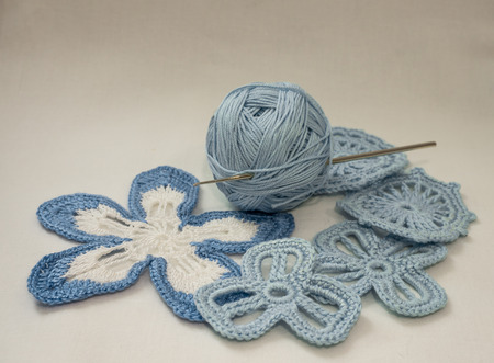 Blue cotton yarn and elements of Irish lace handmadeの写真素材