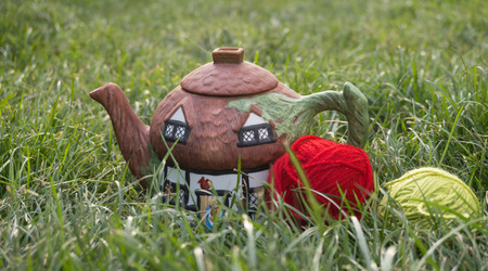 The comfort of home. Ceramic makers in folk style and knitting yarnの写真素材