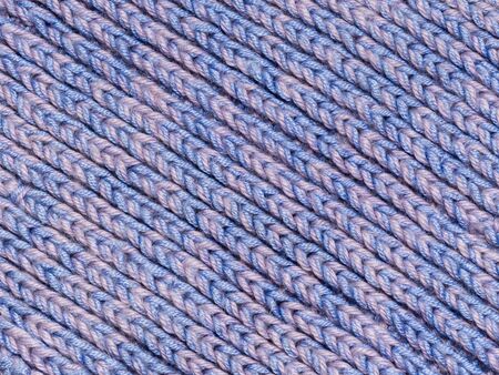Knitted structure of blue threads. Diagonal lines