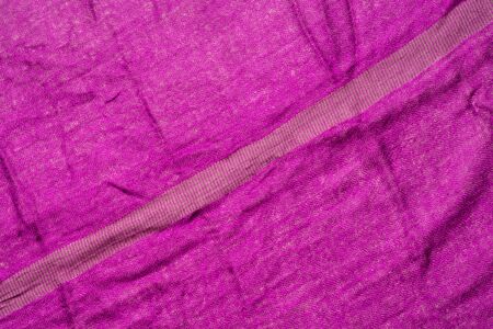 Fuchsia color wrinkled fabric texture. Diagonal lineの写真素材