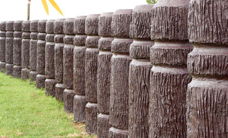 Cement pole in wood like place in curve lineの写真素材