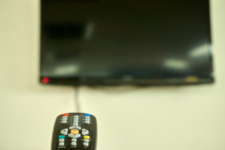 Remote control point at television to openの写真素材