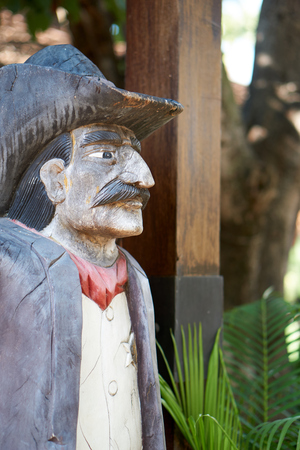 Wood carve cowboy stand in side viewの写真素材