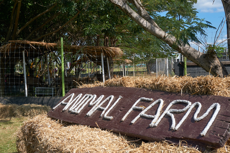 Signs with text animal farm on straw stackの写真素材