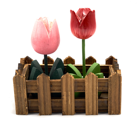 Decoration pink and red wood flower in fenceの写真素材