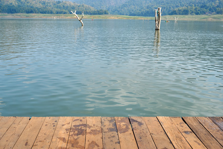 wood board pattern with water and mountain in backgroundの写真素材