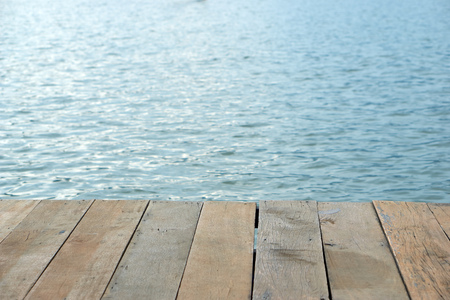 wood board pattern with water in lake in background