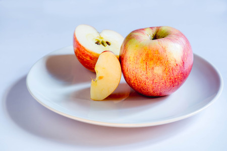 Apple on a white plate.の写真素材