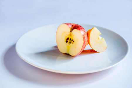 Apple on a white plate.の写真素材
