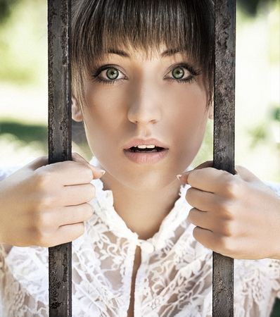 Surprised young women holding a crateの写真素材