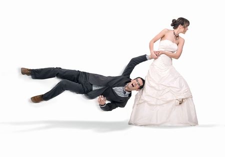 Bride abusing groom, isolated on whiteの写真素材