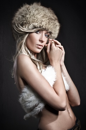 Stunning blonde beauty over dark studio background の写真素材