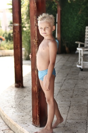 Young boy posing on the beachの写真素材