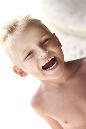Young boy posing on the beachの写真素材