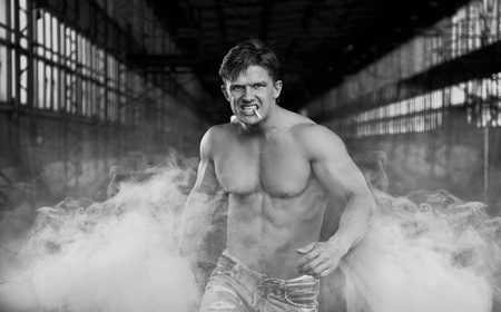 Handsome muscular man walkingの写真素材