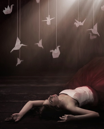 Beautiful brunette in dreamy origamiの写真素材