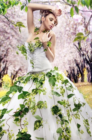 Stunning brunette in a spring gardenの写真素材