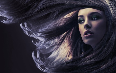 Beautiful lady with long brown hair, at moonlightの写真素材