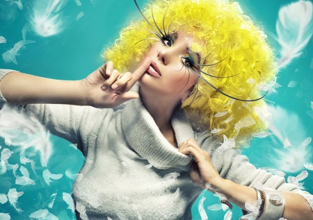 Fine art photo of a girl on the blue backgroundの写真素材