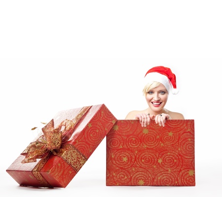 Cheerful santa woman in a christmas boxの写真素材