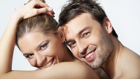 Portrait of happy young woman and man smiling togetherの写真素材