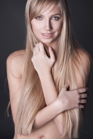 portrait of beautiful young woman with long straight blond hairの写真素材