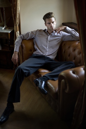 Fashionable man sittingの写真素材